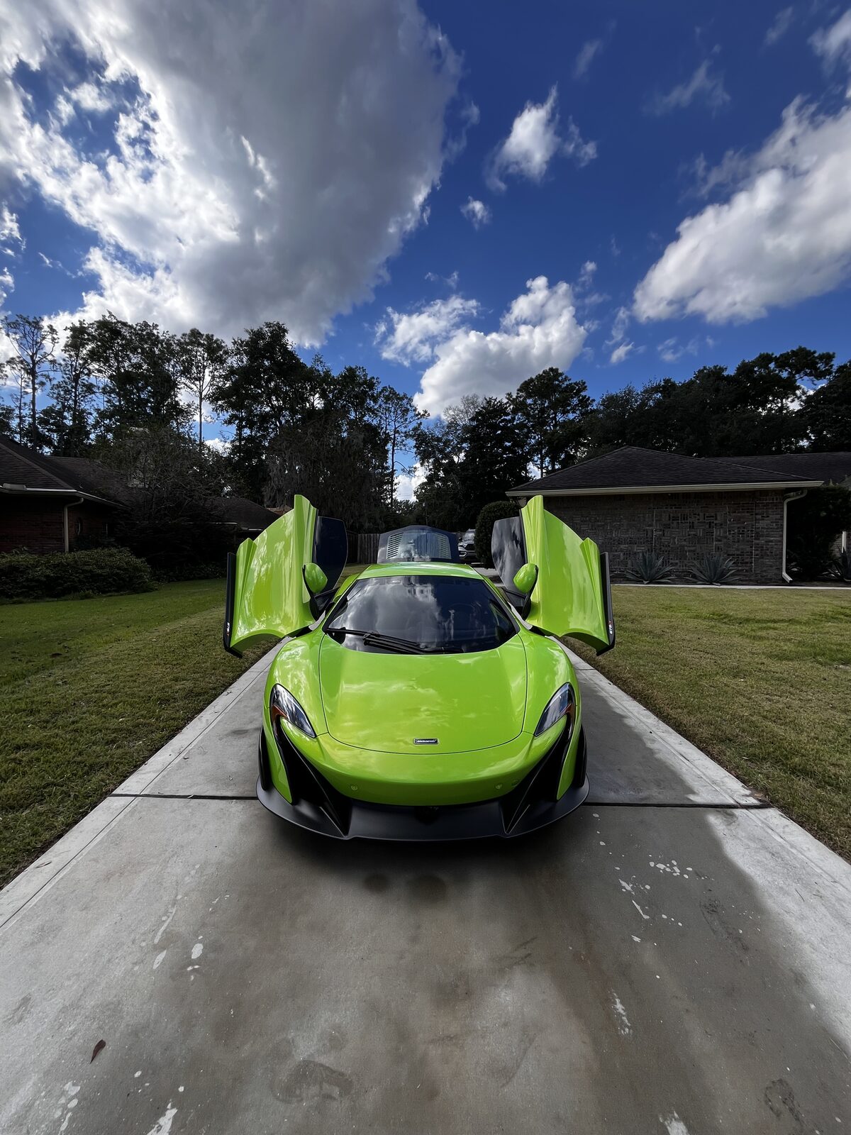 Green McLaren detailed and gleaming under natural light